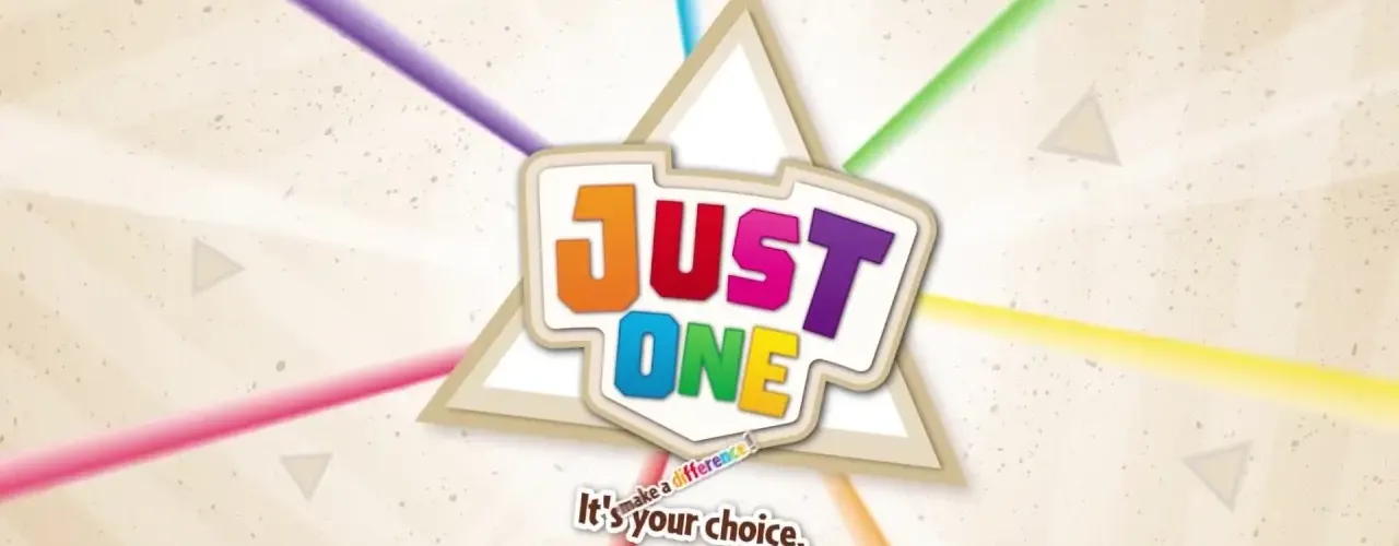 Der Karton ist beige und in der Mitte steht mit bunten Buchstaben “Just One”. Vom Schriftzug gehen bunte Strahlen nach außen.